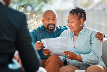 couple reviewing documents with a lawyer